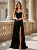 Robe noire longue coupe trapèze entièrement pailletée avec corsage corset et fente élégante