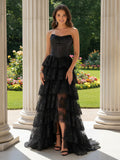 Élégante robe noire bustier coupe trapèze en tulle et dentelle avec volants contrastants