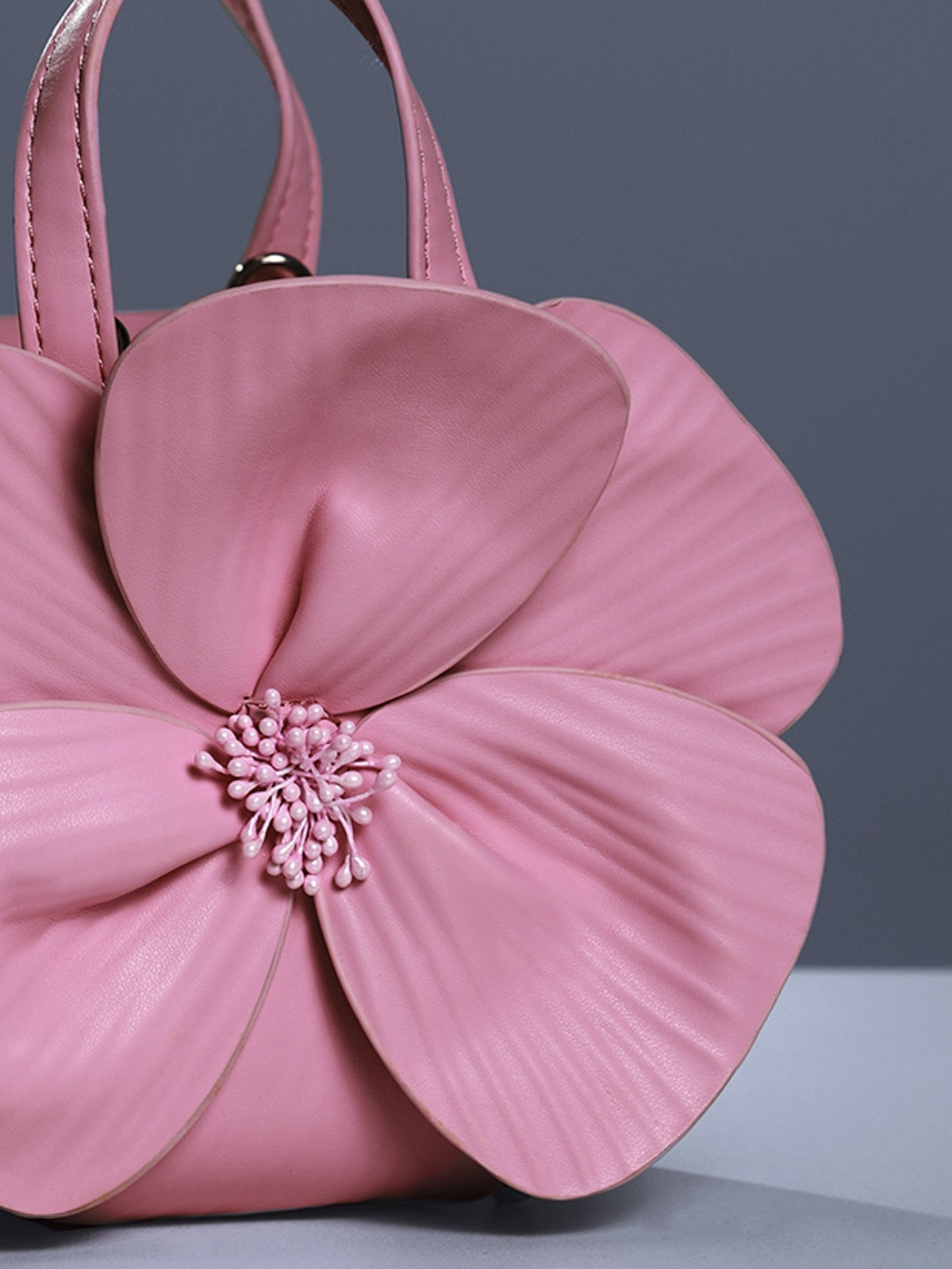 Sac en cuir rose à motif floral