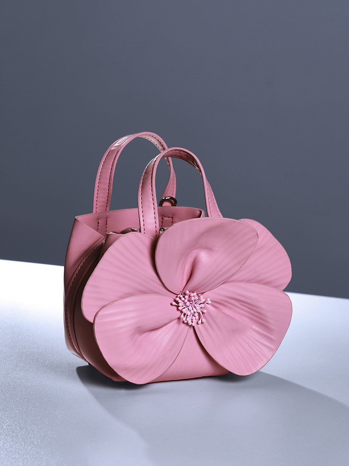Sac en cuir rose à motif floral