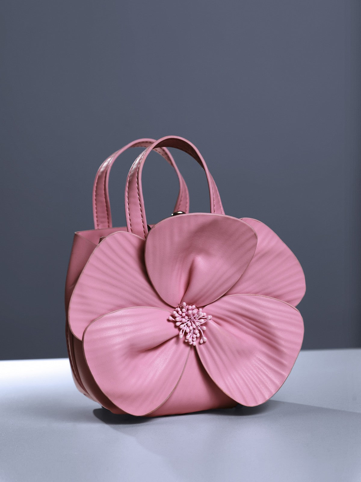 Sac en cuir rose à motif floral