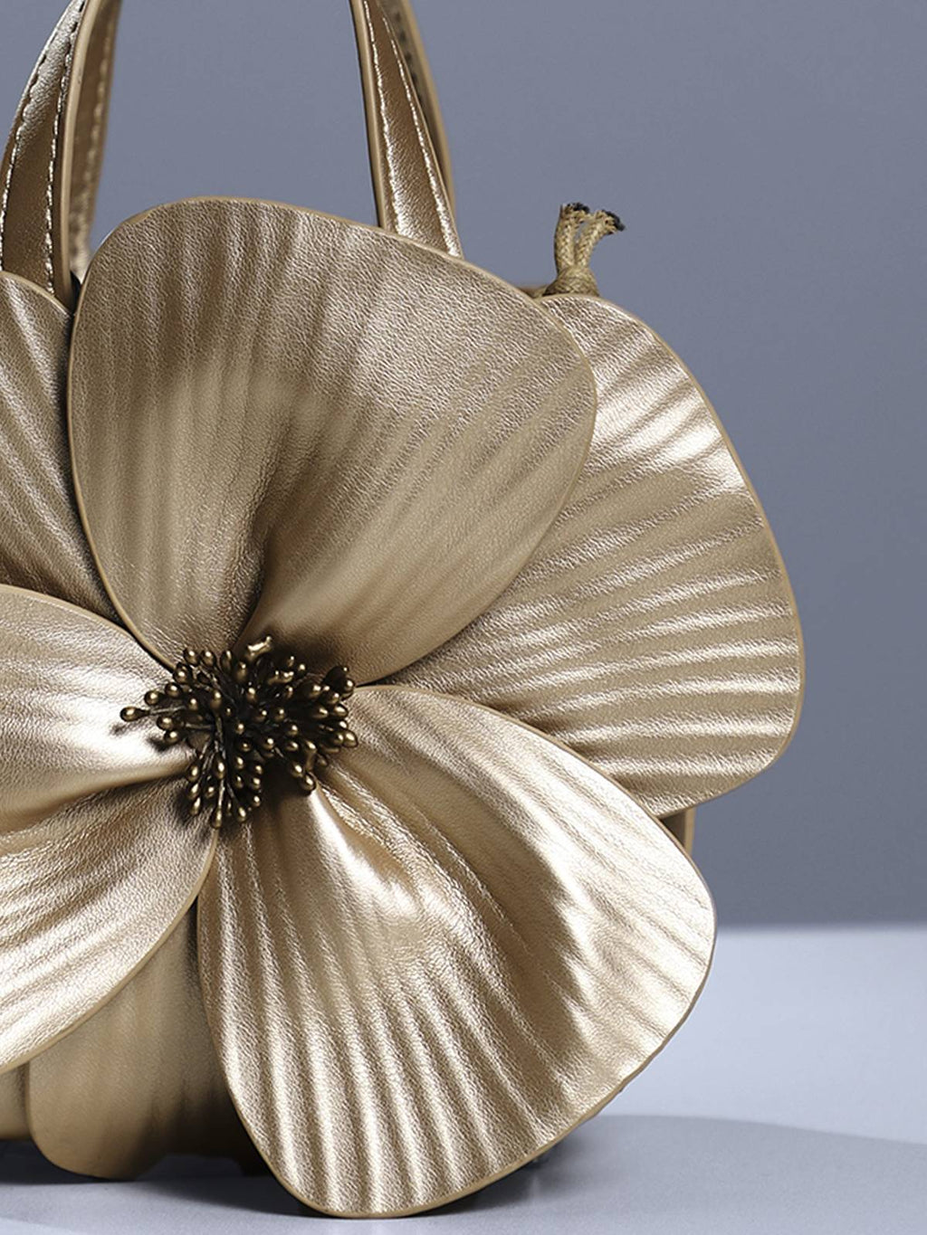 Sac à fleurs en cuir doré Acsah