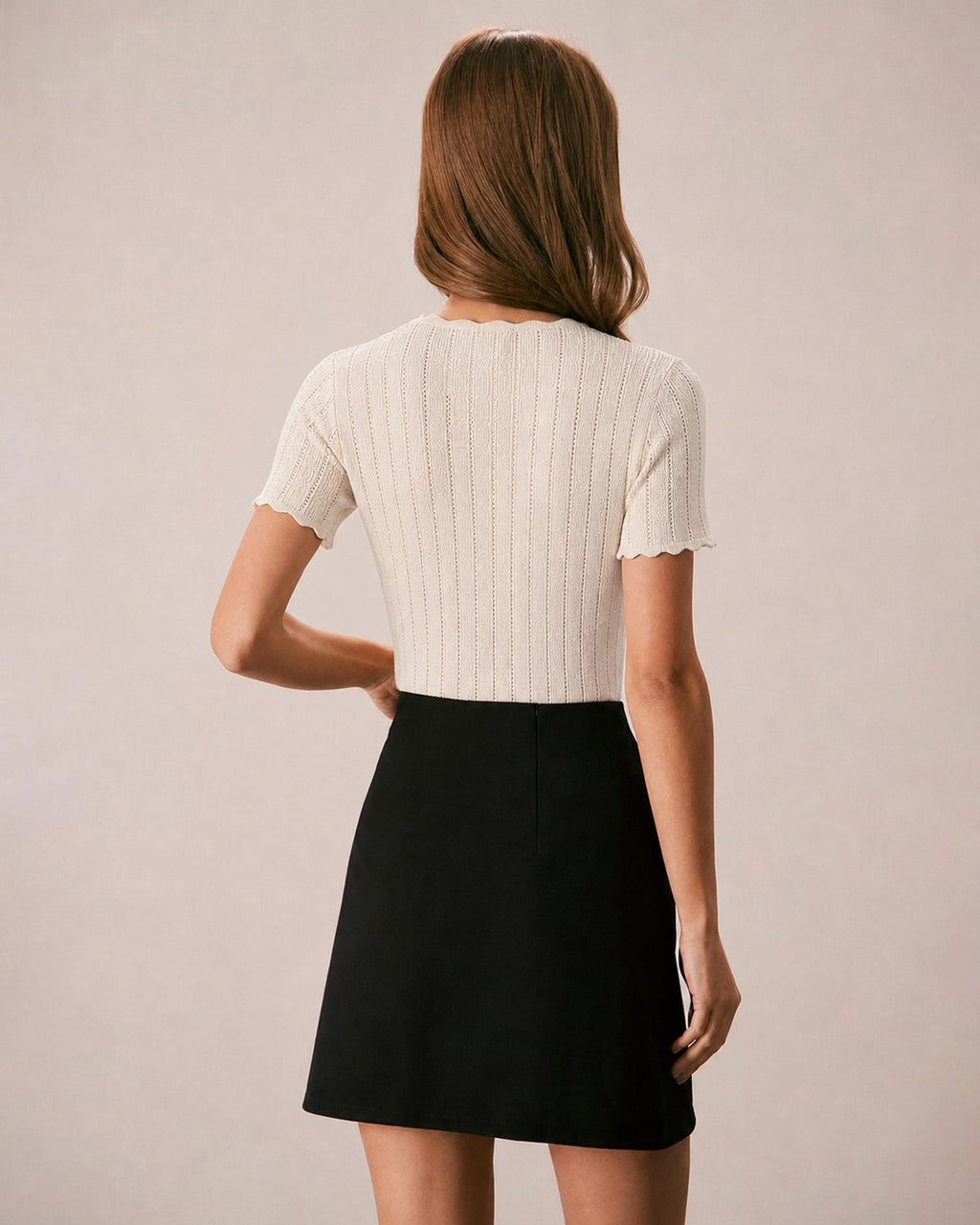 Pull en maille couleur abricot à découpes et boutons