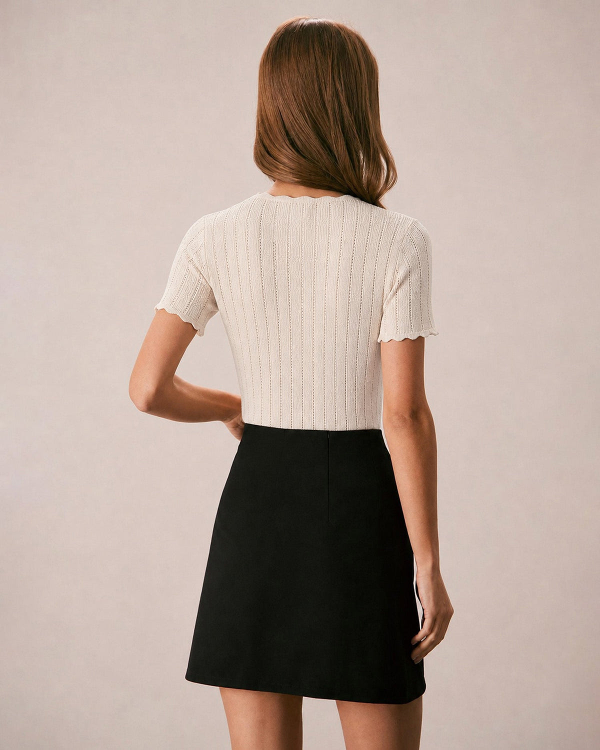 Pull en maille couleur abricot à découpes et boutons