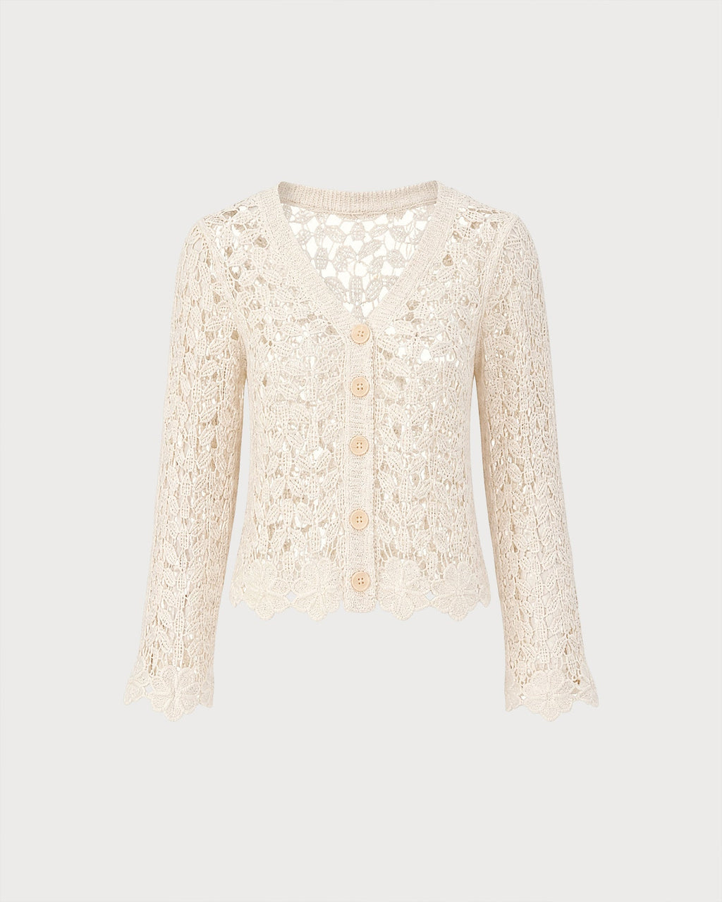 Gilet en maille couleur abricot à découpes et boutons