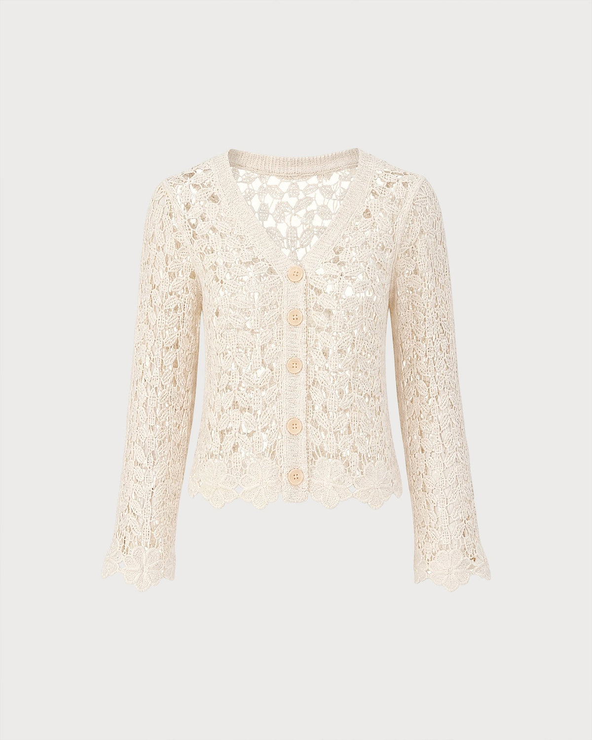 Gilet en maille couleur abricot à découpes et boutons