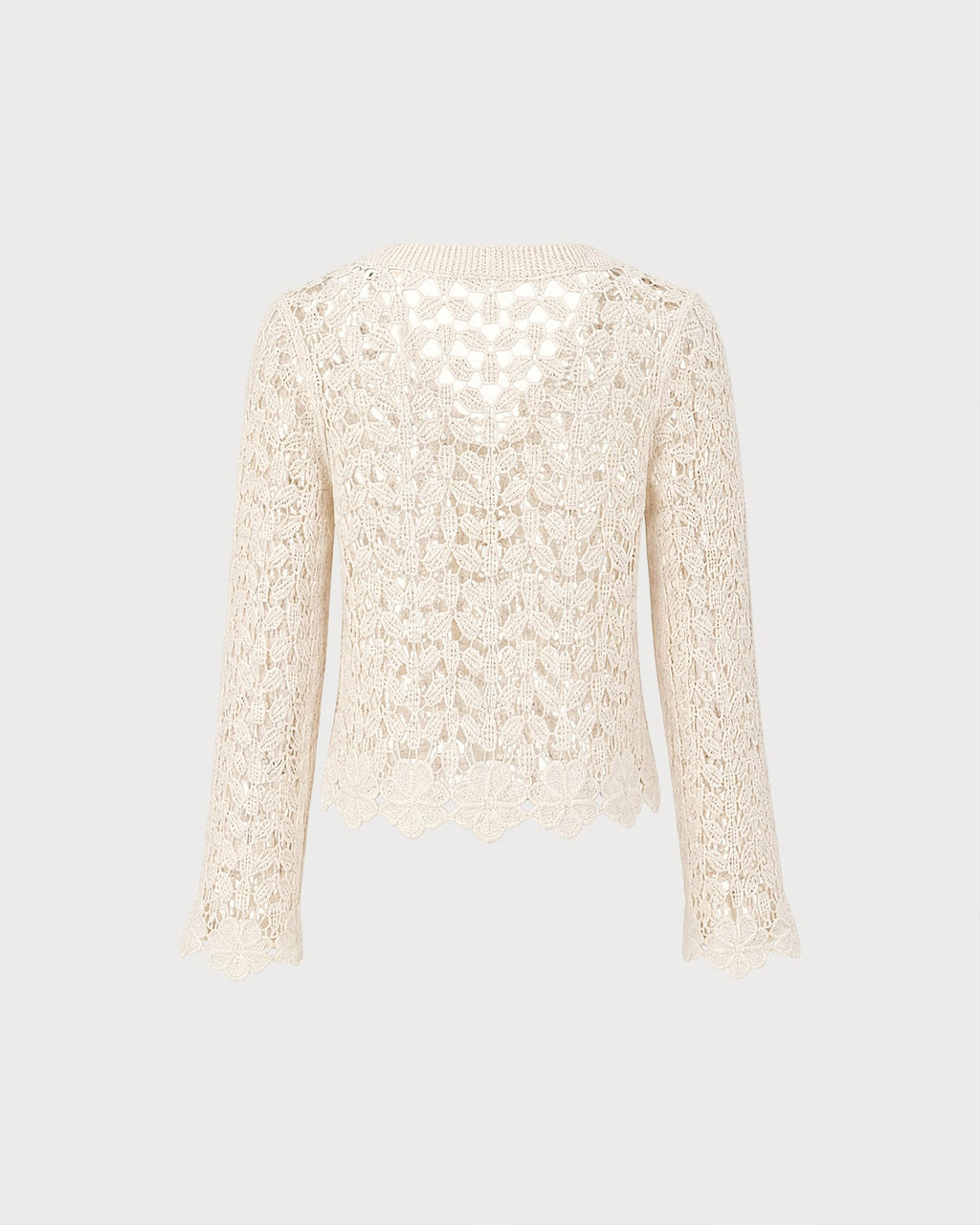 Gilet en maille couleur abricot à découpes et boutons