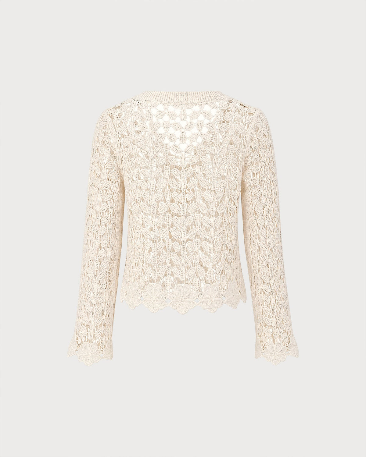 Gilet en maille couleur abricot à découpes et boutons