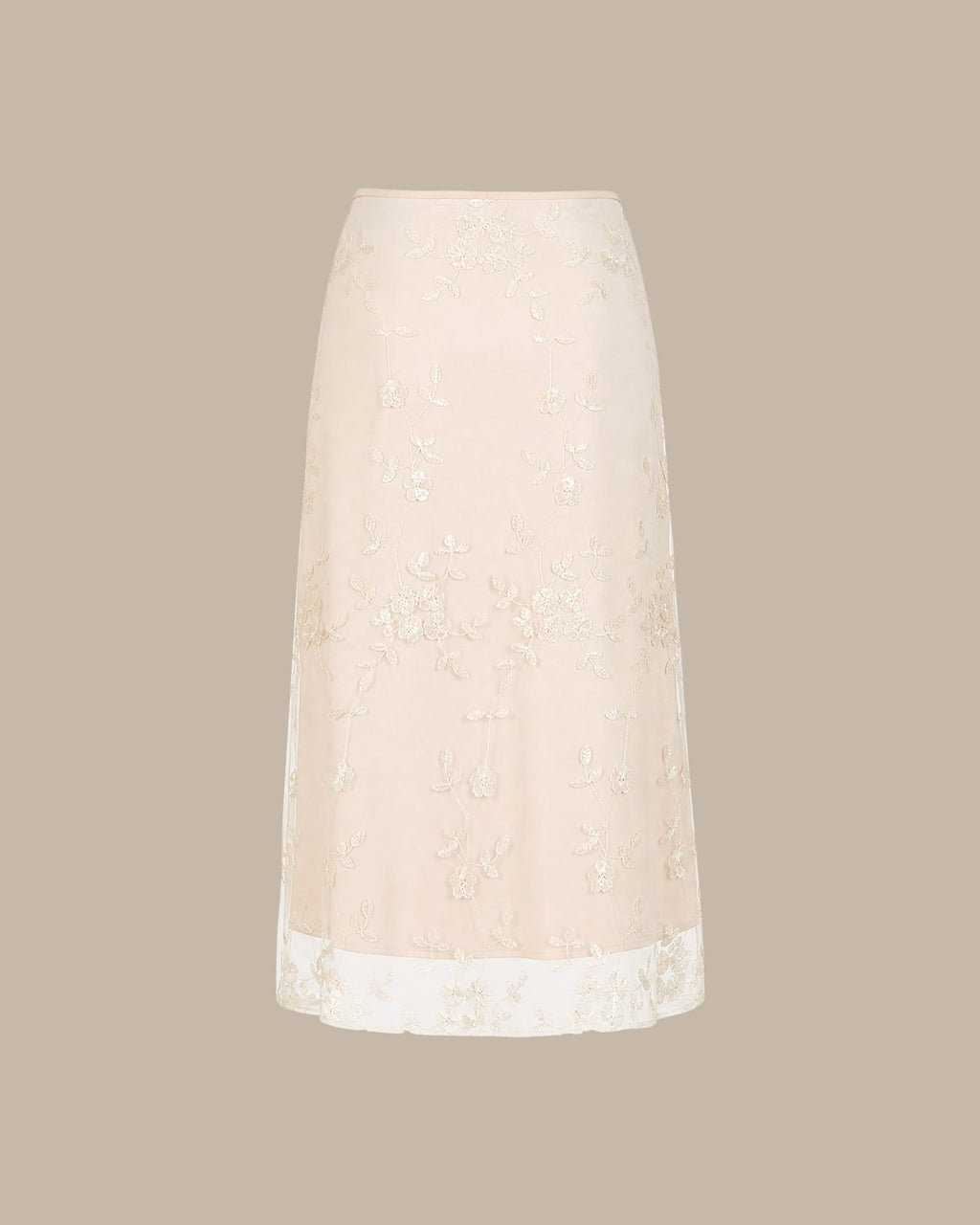 Jupe midi en mesh couleur abricot avec broderies florales