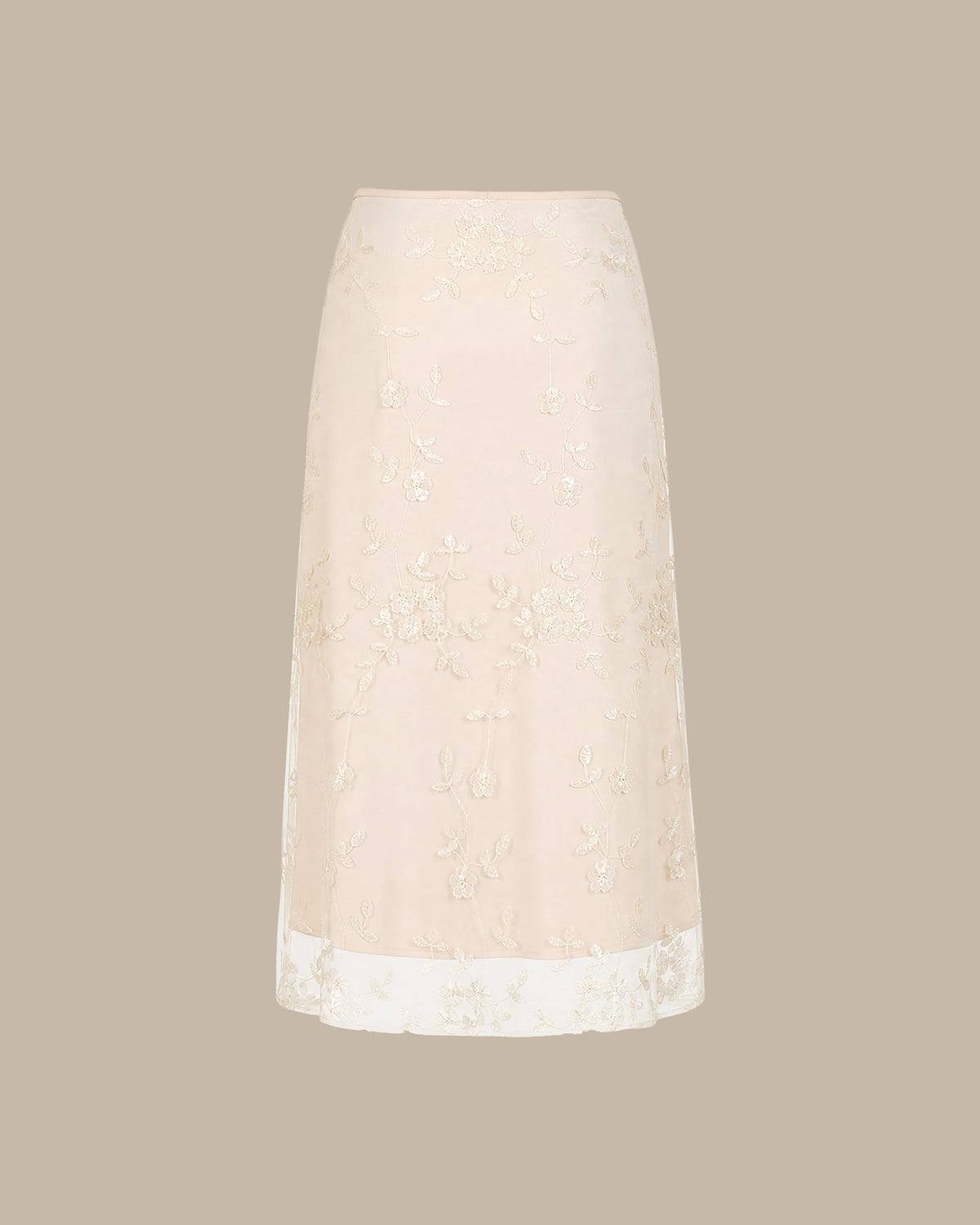 Jupe midi en mesh couleur abricot avec broderies florales