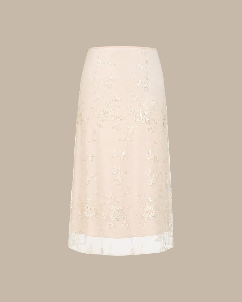 Jupe midi en mesh couleur abricot avec broderies florales
