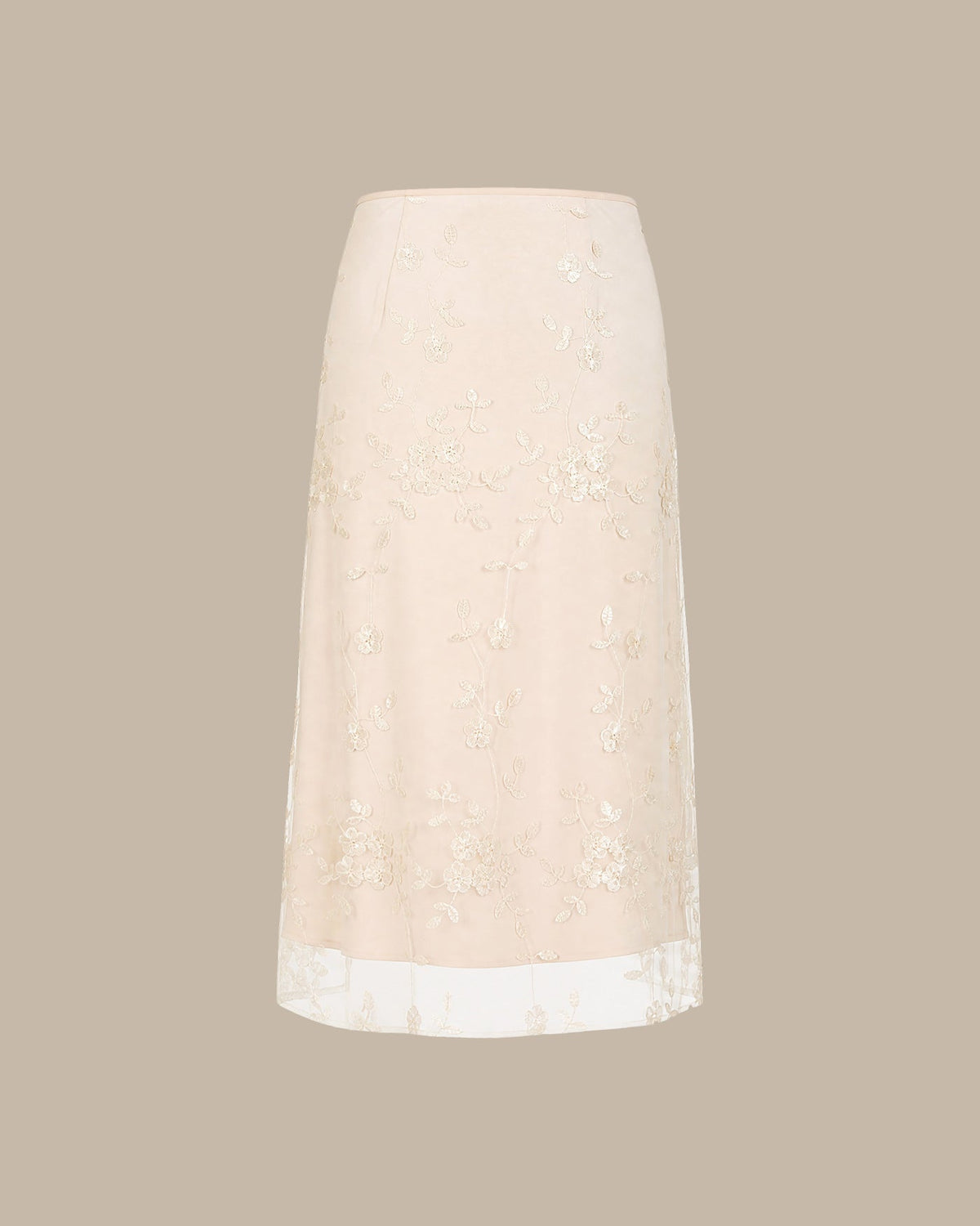 Jupe midi en mesh couleur abricot avec broderies florales