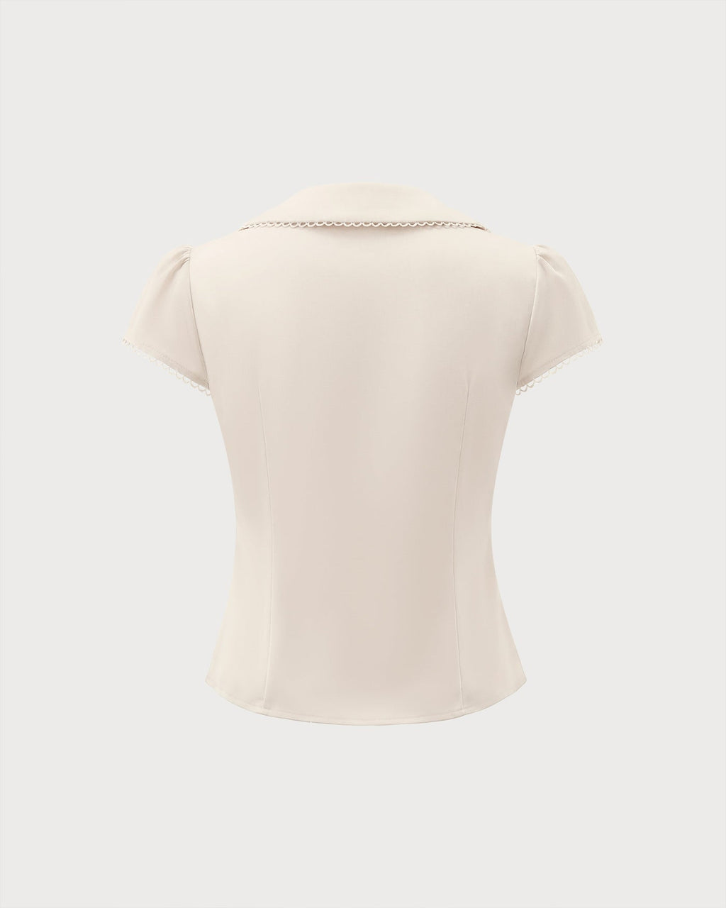 T-shirt couleur abricot avec col en dentelle et empiècements