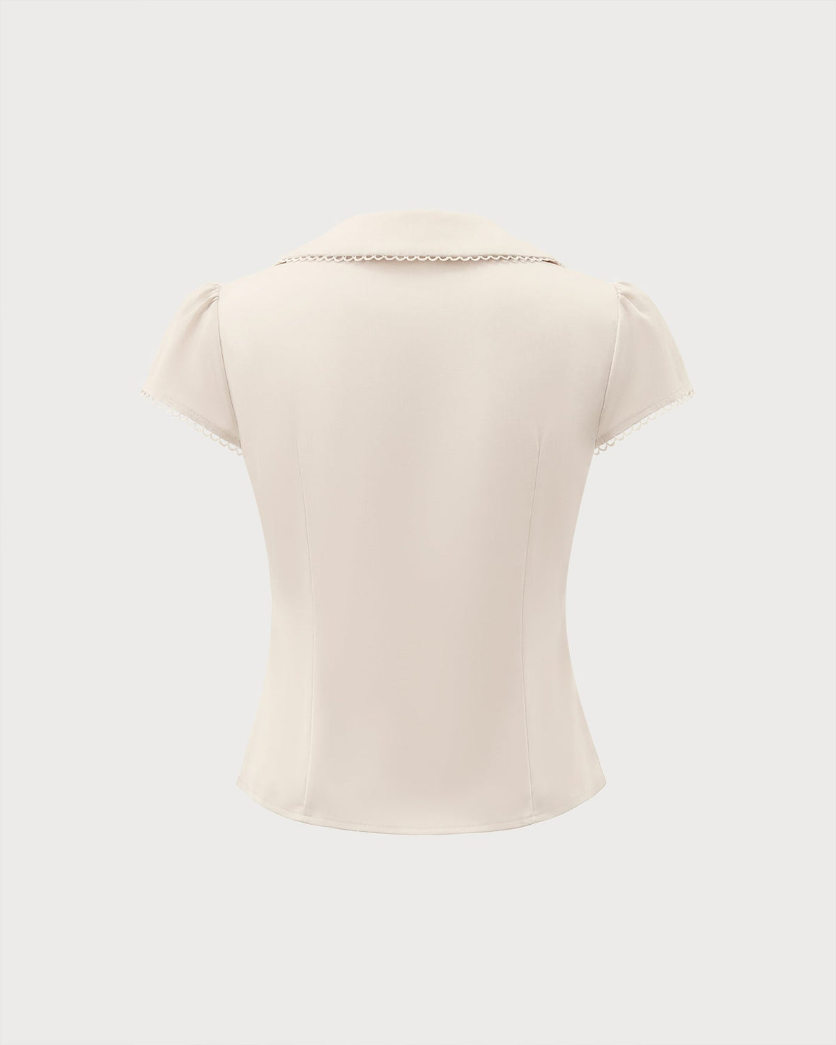 T-shirt couleur abricot avec col en dentelle et empiècements